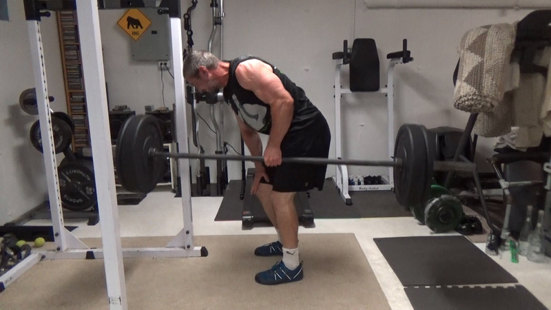 Build a Thicker Upper Back With One-Arm Suitcase Barbell Rows