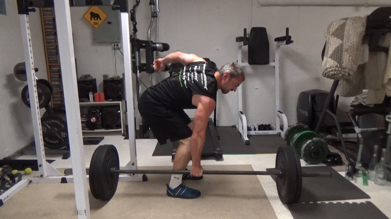 Build a Thicker Upper Back With One-Arm Suitcase Barbell Rows