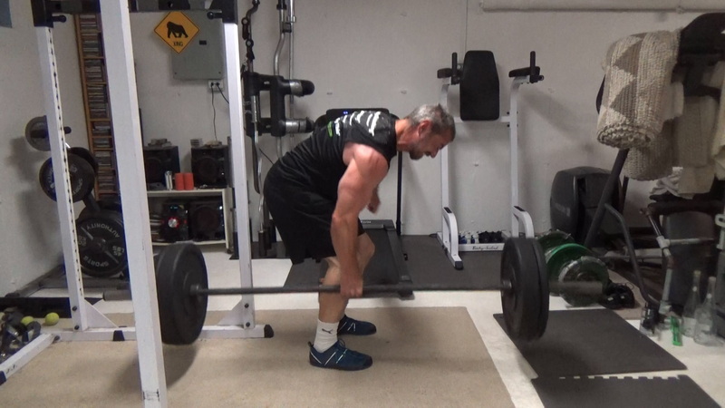 Build a Thicker Upper Back With One-Arm Suitcase Barbell Rows