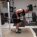 Build a Thicker Upper Back With One-Arm Suitcase Barbell Rows