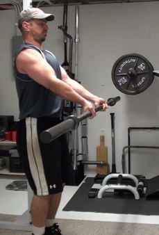 Arms-Forward Barbell Curls Lowering