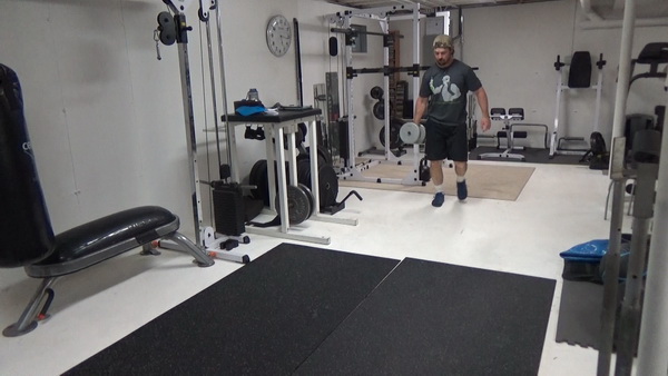 Pass-Under Walking Lunges With a Dumbbell
