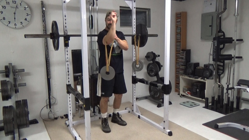 Elbow Band-Plate Hanging Front Squats Loop the bands around elbows